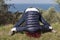 Woman relaxing, performing joga on sea coast