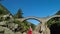 woman relaxing at Ponte dei Salti Bridge