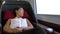 Woman relaxing sleeping in comfortable first class seat in train during travel