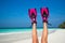 Woman relaxing on summer beach vacation holidays lying in sand.