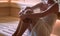 Woman relaxing and sweating in Finnish sauna