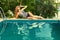 Woman relaxing in swimming pool