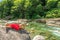 woman relaxing by Verzasca riverside