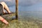 Woman relaxing in a waterfront cabana