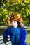 Woman relay at park bench under tree