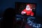 Woman remotely talking with Santa Claus on a video call on your computer. A man dressed as Santa Claus congratulates his