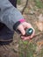 Woman  removes list from Geocaching ampoule