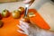 Woman removing the core and pips from the juicy apple with metal apple corer