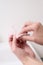 Woman removing nail varnish with acetone