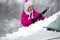 Woman removing snow from car