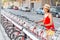 Woman renting bicycle at public urban cycle transport station