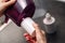 Woman replacing filter in a water pitcher. Female hand removes an old tap water purification cartridge from a jug.