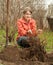 Woman resetting bush sprouts