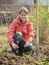 Woman resetting raspberry sprouts