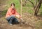 Woman resetting tree sprouts