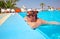 Woman at the resort swimming in the pool