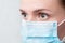 Woman in respiratory mask, closeup portrait. Influenza, quarantine, coronavirus, covid-19