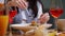 A woman in a restaurant eating pasta fettuccine