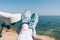 Woman resting after bicycle ride on sea shore