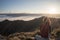 Woman resting on the mountain top