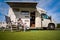 Woman resting near motorhomes in nature. Family vacation travel, holiday trip in motorhome RV, Caravan car Vacation.