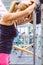 Woman resting tired after lifting barbell on muscular training