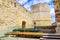 Woman resting in the tourist visit to the medieval castle of the city of Zamora Spain.