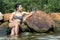 Woman in retro swimsuit on the rocks