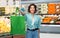 Woman with reusable canvas bag for food shopping