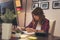 Woman reviewing documents in a home office