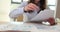 Woman reviews documents neatly arranging papers on table