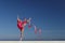 Woman rhythmic gymnast with red ribbon