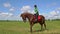 Woman ride horse hoof beats and play with rider