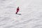 Woman rides on a snowboard on a mountain slope.