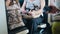 A woman rides the train with a dog on his lap.