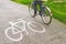 Woman riding bicycle on a bike path