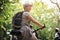 Woman riding bicycle in the forest