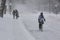 Woman riding bike on Laurier Street during snow storm