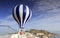 Woman riding blue hot air balloon at zhenhaijiao peninsula, adobe rgb