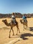 Woman riding a camel