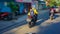 Woman riding fast in her Honda Vario moped