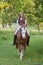 Woman riding her horse bareback