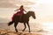 a woman riding a horse on the beach near water's edge