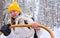 Woman riding in husky dogs sledge in Rovaniemi forest reflex