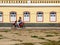 Woman riding a motorcyle without a helment in the historic center of Oeiras, Brazil