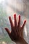 Woman right hand touching dust Dirty mosquito wire screen window, Light & Shadow shot, Silhouette, Close up shot