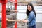 Woman ringing a bell in a Buddhist temple