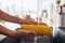 Woman rinsing fresh corns by hands in the kitchen-sink. Going to prepare salad.