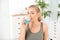 Woman rinsing mouth with mouthwash