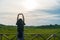 Woman rise hands up to sky freedom concept.